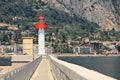 Lighthouse on marina in Menton, France,