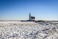 The lighthouse of Marken, `het Paard van Marken` in winter and the frozen Markermeer, Holland