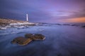 Lighthouse in a moody sunset. Royalty Free Stock Photo