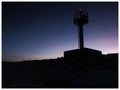 Lighthouse For Navigation And The Dim Light Of The Night Sky