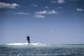 Lighthouse near the coast in the ocean in Penmarch, Brittany, Fr Royalty Free Stock Photo