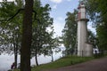 The Lighthouse near the Trees in Park in Petergof Royalty Free Stock Photo