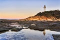 Lighthouse Norah Rise puddle reflect
