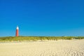 Lighthouse at northern beach of island Texel in Netherlands on summer day Royalty Free Stock Photo