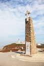 Lighthouse and obelisk with a cross