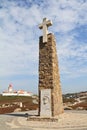 The lighthouse and obelisk with a large white cross