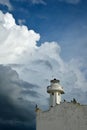 A lighthouse on an old building in Telchac Puerto on the coast of YucatÃÂ¡n on the Gulf of Mexico, cormorants sitting on the roof