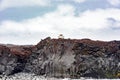 Lighthouse over basalt rocks, Heimaey Island, Iceland Royalty Free Stock Photo