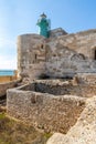 Lighthouse over Castello Maniace Castle fortress at Ionian sea on Ortigia island old town of Syracuse in Sicily in Italy