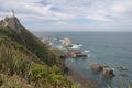 Lighthouse overlooking rocks Royalty Free Stock Photo