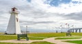 Lighthouse in the park. Warm muggy day in PEI. New Brunswick Confederation Bridge in distance. Royalty Free Stock Photo