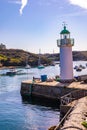Lighthouse at the Picturesque Port of Sauzon, France Royalty Free Stock Photo
