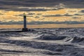 Lighthouse and pier on Lake Huron under a stormy sky - Ontario, Royalty Free Stock Photo