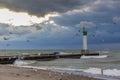 Lighthouse and pier on Lake Huron under a stormy sky - Ontario, Royalty Free Stock Photo