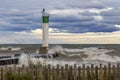 Lighthouse and pier on Lake Huron under a stormy sky - Ontario, Royalty Free Stock Photo