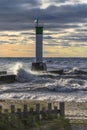 Lighthouse and pier on Lake Huron under a stormy sky - Ontario, Royalty Free Stock Photo