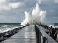 Lighthouse on the pier of Norre Vorupor during storm and heavy sea, Jutland, Denmark