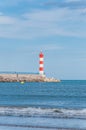 Lighthouse of Port-La-Nouvelle in red and white on cloudy sky