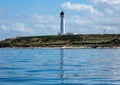 Lighthouse reflected in water in Lossiemouth, Scotland