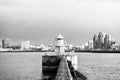 Lighthouse in reykjavik, iceland. Lighthouse tower and stone pier in sea. Seascape and skyline on grey sky. Architecture Royalty Free Stock Photo