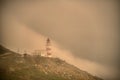 Lighthouse. Rock, hope. Fog