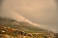 Lighthouse. Rock, hope. Fog