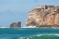 Lighthouse on a rock in Nazare Portugal Royalty Free Stock Photo