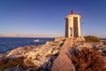 Lighthouse on rocks with boat, sea and waves. Sunny day with blue sky. Porto Cristo, Mallorca Royalty Free Stock Photo