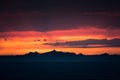 Iles Sanguinaires silhouetted against a dramatic orange sunset