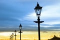 Lighthouse and row of vintage lamps