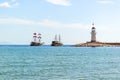 Lighthouse and sail ships in the Mediterranean sea