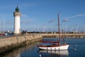 Lighthouse and sailboat moored in Port-Haliguen in Morbihan