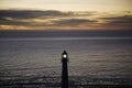 Lighthouse in the sea Royalty Free Stock Photo