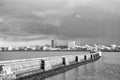 Lighthouse on sea pier in reykjavik iceland. Lighthouse yellow bright tower at sea shore. Seascape and skyline with Royalty Free Stock Photo