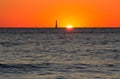Lighthouse in the sea during the sunset Royalty Free Stock Photo