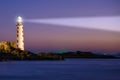 Lighthouse on sea sunset Royalty Free Stock Photo