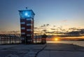 Lighthouse searchlight beam through marine air at night Royalty Free Stock Photo