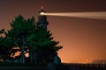 Lighthouse searchlight. Night marine embankment of Weihai