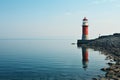 Lighthouse on the seashore, beautiful landscape. Seascape, signal building on the seashore. Coastal landscape with a Royalty Free Stock Photo