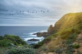 Lighthouse shining protective light over ocean Royalty Free Stock Photo