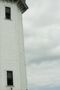 View of Lighthouse Windows from Under Stormy Clouds