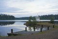 Lighthouse on the shore of lake Royalty Free Stock Photo