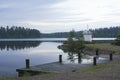 Lighthouse on the shore of lake Royalty Free Stock Photo