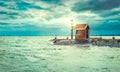 Lighthouse on shore sea with lighting lantern Royalty Free Stock Photo