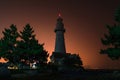 Lighthouse silhouette. Night marine embankment of Weihai