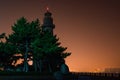 Lighthouse silhouette. Night marine embankment of Weihai