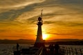 Lighthouse silhouette at sunset