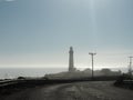 A lighthouse comes into view from the Pacific Coast highway Royalty Free Stock Photo