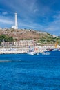 Lighthouse. Small port of Santa Maria di Leuca, southern Italy. Some boats moored Royalty Free Stock Photo