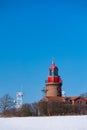 The lighthouse with snow and blue sky in Bastorf Royalty Free Stock Photo